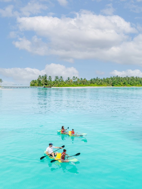 Family of four kayaking at Niyama Private Islands Maldives
